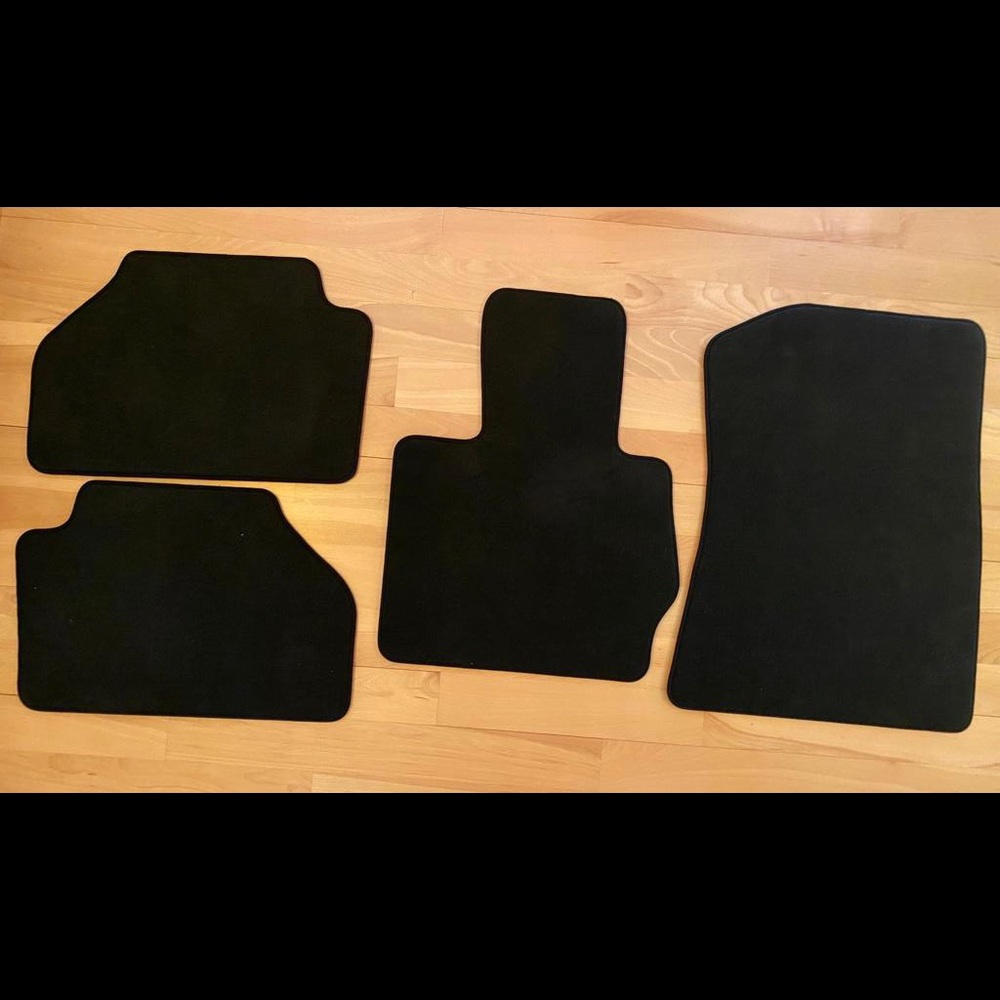 Set of BMW OEM floor mats from 2017 X3. Black, BMW part number is - 7327943-05.